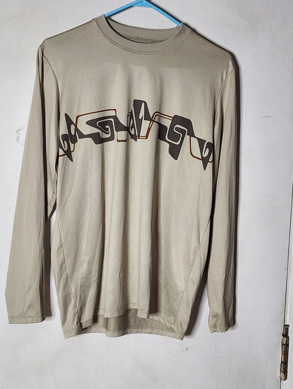 Patagonia Men's Long Sleeve Tee in Tan with Black & Brown Chest Print